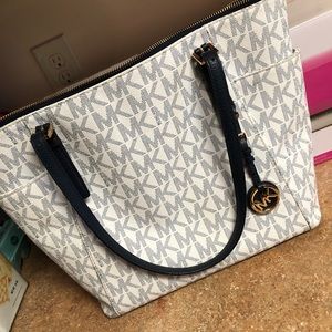MK (Michael Kors) purse with matching wallet.